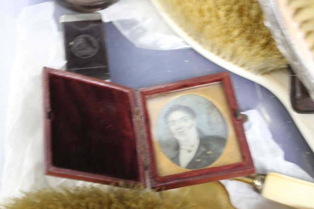 A box of assorted curios including a portrait miniature